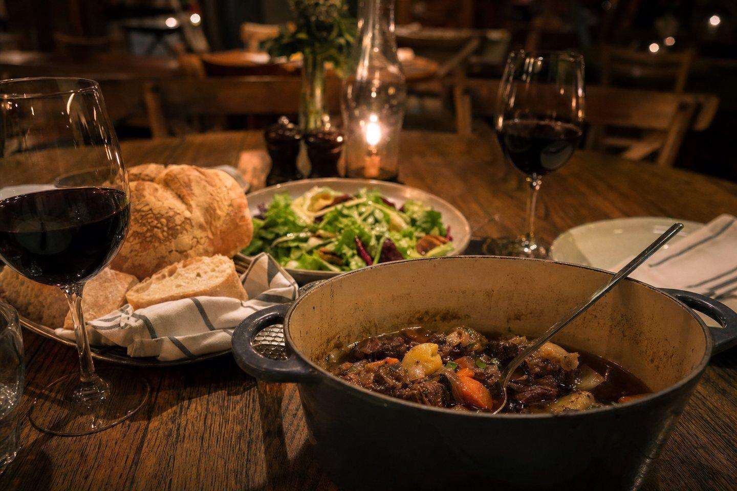 A rustic family-style meal on a wooden table (AI-generated image)